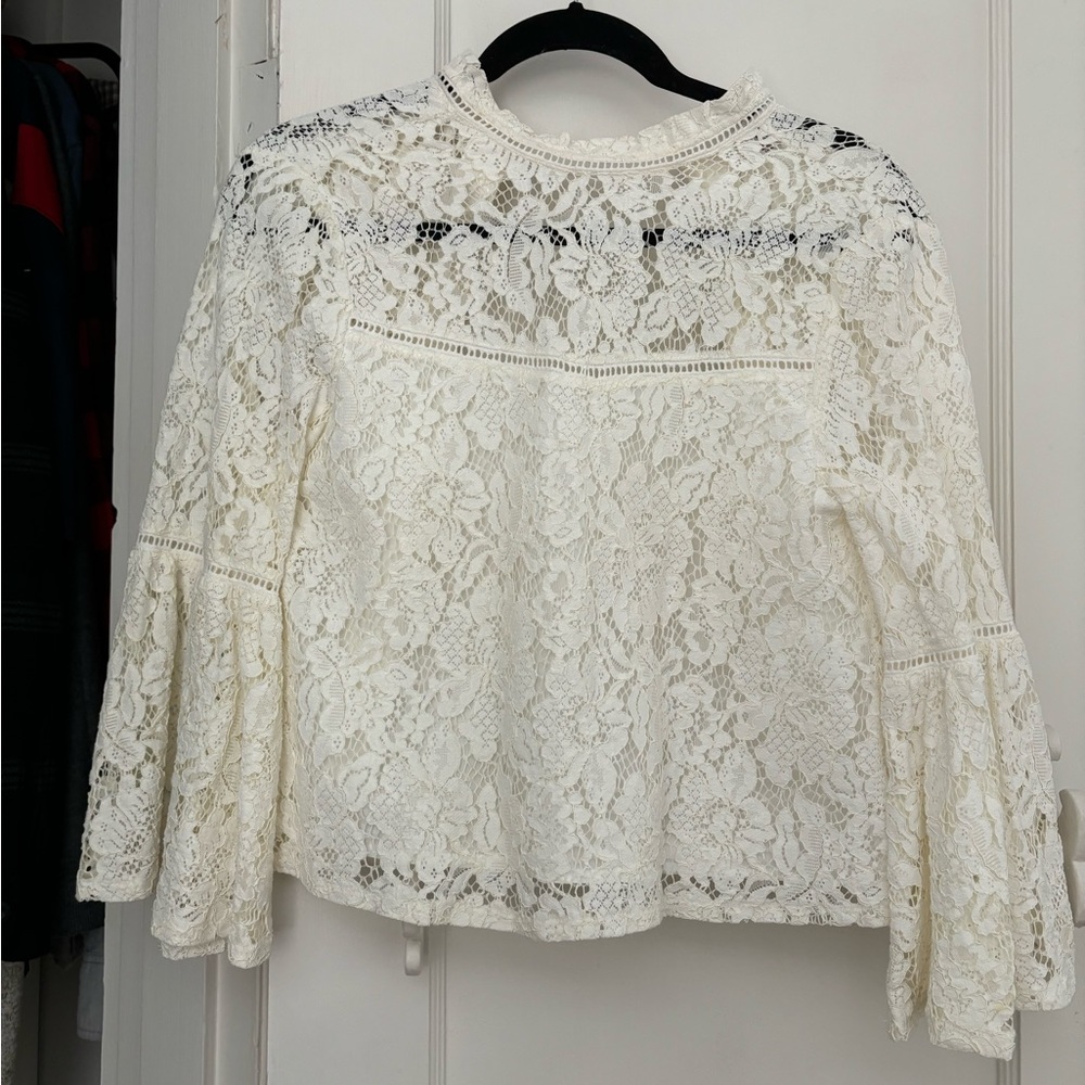 Bell sleeve lace top with buttons up the back.
